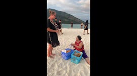 Elderly beach seller becomes a hit with her hilarious sales song