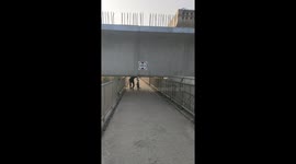 Bungling engineers build motorway on top of footbridge... forcing pedestrians to duck underneath