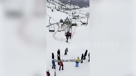 Skiers rescue child dangling from chairlift using makeshift cushion