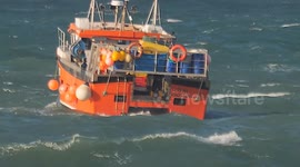 UK Weather, sunny but cold with warmer weather forecast, fishing boat Serene rides out the choppy seas, Newqauy, Cornwall, UK