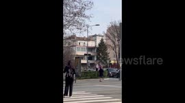 Serbia: Cars move through the streets of Belgrade with Serbian flags