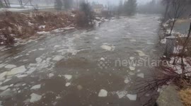 Chunks of ice float through river as spring thaw begins in Maine