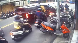Pit bull leaps from car window and attacks motorcycle rider