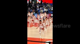 Young boy loses ball during basketball performance but impressive with air dribbling to stay in sync