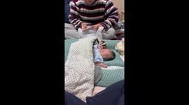 Baby reacts to nail clipper sound but stays asleep in Higashiosaka, Japan