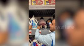 Parents use tot to crawl onto shelf and grab out-of-reach product in clever hack