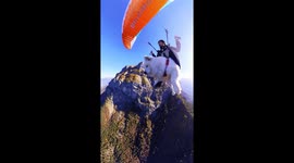 Man And Samoyed Paraglide Over French Alps