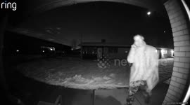 Man Acknowledges Camera As He Pees On Stranger's Porch