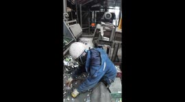 Recycling worker sifts through thousands of batteries... even as they explode