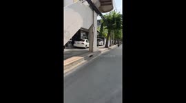 Policeman chases motorcyclist caught riding on pavement