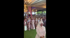 Bridesmaids all avoid catching the bride's wedding bouquet