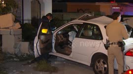 US, Los Angeles: Athens Car Lands In Front Yard After Rollover Crash