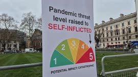 Campaigners Outside Parliament protesting the cuts to UK international aid.