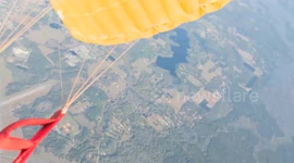 Group of 20 skydivers perform dazzling displays with deployed parachutes at 100mph