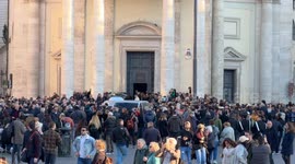 People outside the Church of the Artists during the funeral of Italian actress Eleonora Giorgi in Rome.