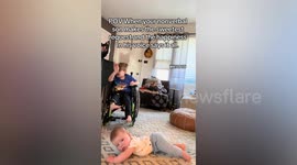 Sweet moment non-verbal boy holds his baby brother on his lap