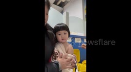 China: The Little Girl's Facial Expressions While Getting an Injection