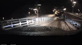 Car skids down slope on icy parking area