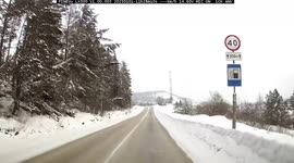 Lorry driver narrowly escapes head-on collision with out-of-control car on icy road