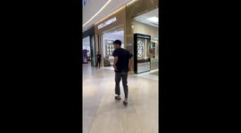 Man falls attempting tumbling trick in front of store staff in Hanoi, Vietnam