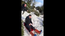 Person falls while sledding after hitting a plant in UK