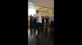 Wedding guest spins into spotlight with hilarious breakdance move