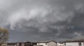 Storm clouds swirl over homes in Illinois amid tornado threat