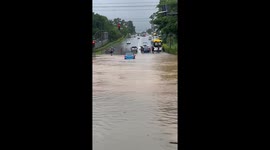 Driver instantly regrets driving through flooded road in Malaysia