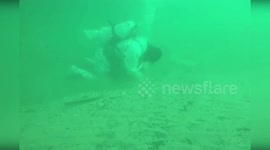 Soldiers continue oil spill cleanup in Russia