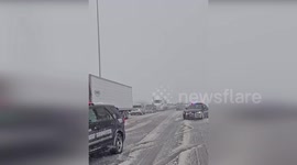 Blizzard batters vehicles on roads in Omaha, Nebraska