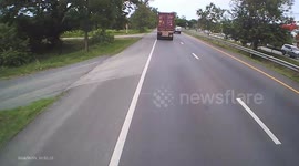 Driver's plastic bag flies off the back of his pickup truck and blocks oncoming traffic