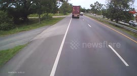 Driver's plastic bag flies off the back of his pickup truck and blocks oncoming traffic