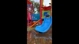 Baby Slides Into Mud Puddle