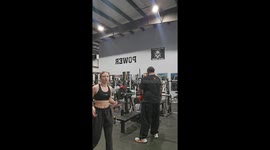 Heartwarming moment gym goers comfort woman after she walked across their camera