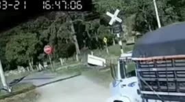 Two injured as train slams into lorry recklessly crossing tracks