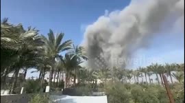 Israeli warplanes launch an airstrike targeting a residential building west of Deir Al-Balah city