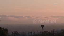 US, Los Angeles: San Fernando Valley Dense Fog Rolls Over Santa Monica Mountains