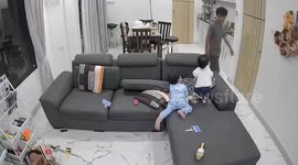Hero brother leaps across sofa to save falling toddler