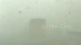 China: Strong winds hit Xinjiang, police rescues trapped truck drivers