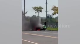 Luxury green Lamborghini bursts into flames on road in Cambodia's casino city