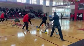 Police officers have lively dodgeball match high school pupils
