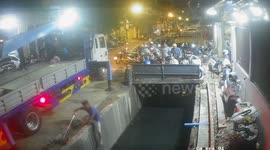 Clumsy street sweeper falls into canal in Cambodia