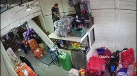 Worker falls after losing balance while handling crates in Mexico