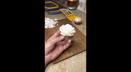 Artistic chef magically transforms ordinary onion into stunningly realistic white rose