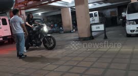 Girl's first time on motorbike fails... as friends stop her from falling