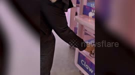 Man uses drone to win prizes from claw machine