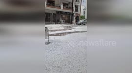 Flash floods flow through streets as hailstorms hit Spain