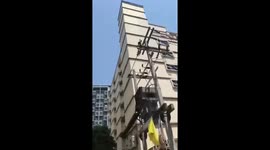 Water cascades down building as earthquake hits Bangkok