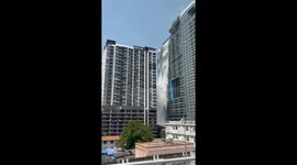 Water pours over high-rise apartment block during Bangkok earthquake