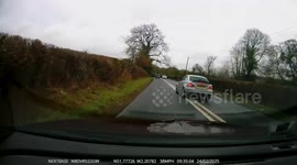 Lunatic driver overtakes on double white lines on the A46 near Painswick, Gloucestershire.